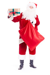 Santa Claus putting Christmas gift into red sack on white background