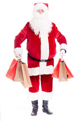Portrait of Santa Claus posing with bunch of shopping bags on white background