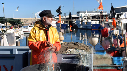 portrait of a fisherman in the harbor