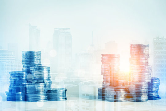 money management business ideas with coin stack money double expore with cityscape with light flare
