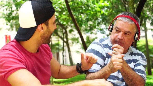 Two Friends/ Father and Son Dancing, Listening Music and Having Fun