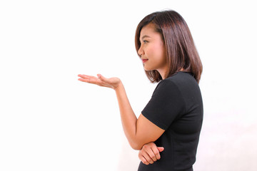 Beautiful young Asian woman fashion make up showing empty copy space on the hand palm. studio lighting white background.