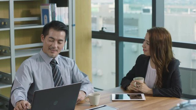 business people conducting performance appraisal in office