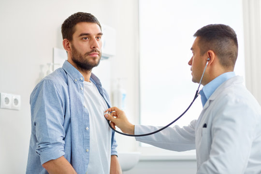 doctor with stethoscope and patient at hospital