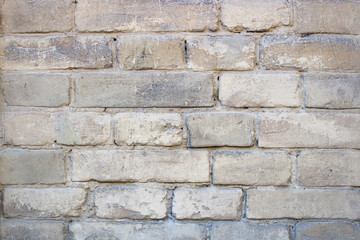 Yellow old brick wall background