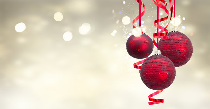 Red christmas balls on festive glowing background banner