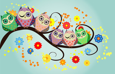 Bright cute cartoon owls sit on the flowering branches of fantastic trees