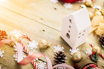 festive background concept with christmas decorating items on wooden background with light filter