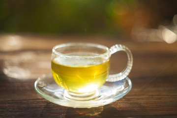 delicious green tea in  beautiful glass bowl on table