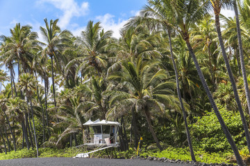 Black sand beach with lifeguard on Hawaii Big Island