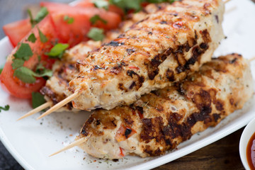Close-up of lula kebabs made of chicken meat, selective focus, shallow depth of field
