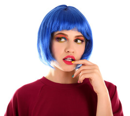 Young woman with rainbow makeup and blue hair, isolated on white