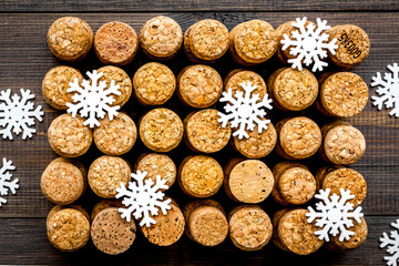 Corks of wine bottles background on dark wooden background top view close up