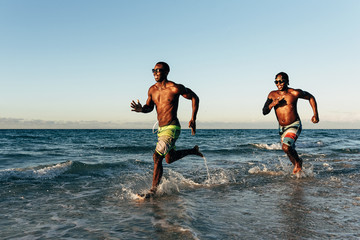 Two cuban friends having fun in the beach.