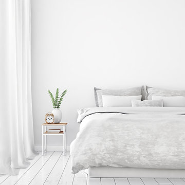 Home interior wall mock up with unmade bed, cushions, curtains, green plant and alarm clock in white bedroom. 3D rendering.