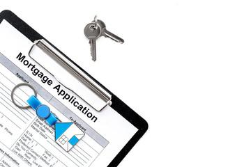 Mortgage application near apartment keys on white background top view copyspace