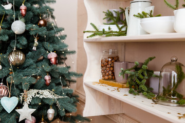 Decorative christmass tree with kitchen shelf.