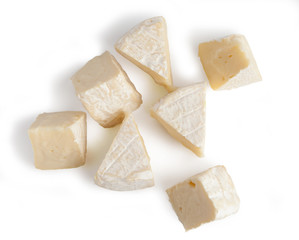 Brie cheesecakes, trisubbles, slices. Fresh cheese, Camemberttes. Isolated on white background.
