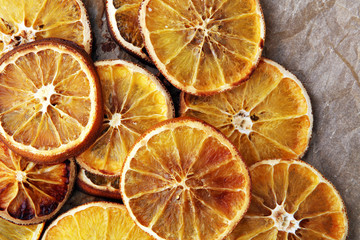 natural background dry sliced oranges, top view close-up.