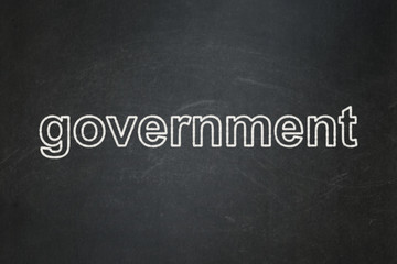 Obraz premium Political concept: text Government on Black chalkboard background