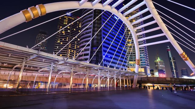 4k Time-lapse of People walking at Chong Nonsi skywalk at night, Bangkok, Thailand