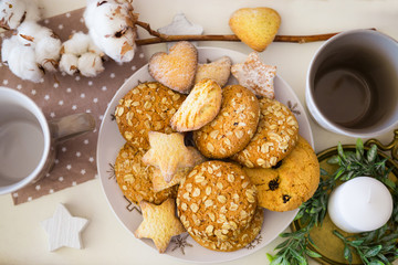 Christmas composition with cookies, cup for coffee and candle