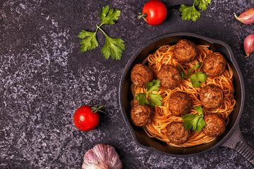 Roasted  meatballs with spaghetti.