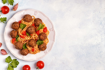 Roasted  meatballs with spaghetti.