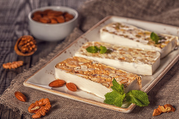 Nougat with honey and nuts, selective focus.
