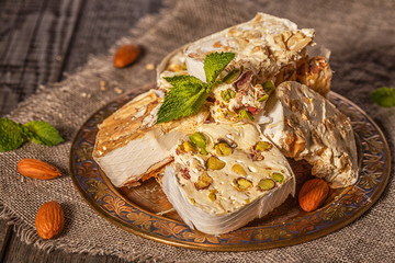 Nougat with honey and nuts, selective focus.