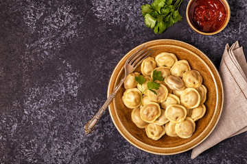 Homemade meat dumplings - russian pelmeni.