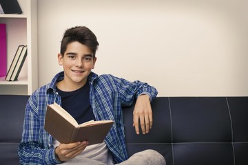 child, teenager or preteen reading or studying at home