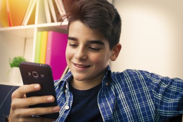 children, teenager or preteen with mobile phone at home