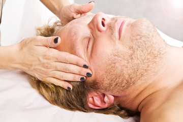 Fototapeta na wymiar Man getting massage in thebeauty center