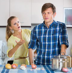 man and frustrated housewife having bad argument