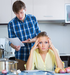 woman consulting with husband