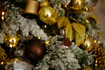 Gold Christmas de-focused lights with decorated tree
