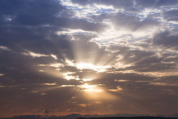 Colorful dawn/dusk sky with clouds background.