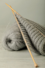 Knitting from woolen threads of gray color.