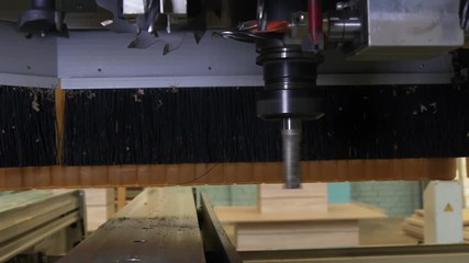Milling machine wood CNC for industrial furniture production. Modern technologies of woodworking industry on professional equipment.