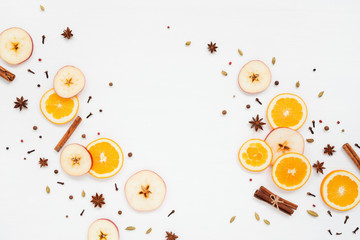 Ingredients for mulled wine on white table. - obrazy, fototapety, plakaty