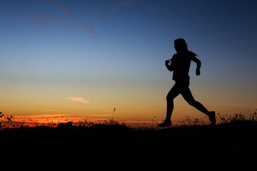 Silhouette of a woman running
