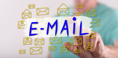 Man touching an e-mail concept on a touch screen