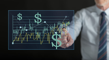 Man touching a stock exchange concept on a touch screen