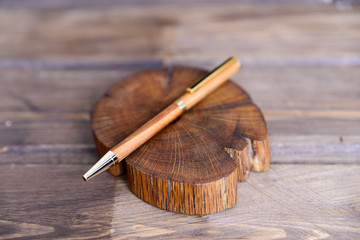 wooden writing pens on a wooden table - 182890252
