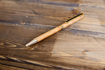 wooden writing pen on a wooden table