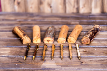 wooden writing pens on a wooden table