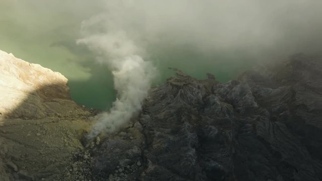 Kawah Ijen, crater with acidic crater lake the famous tourist attraction, where sulfur is mined. Aerial view of Ijen volcano complex is a group of stratovolcanoes in the Banyuwangi Regency of East