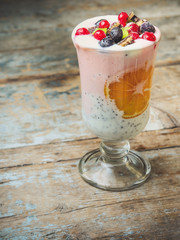 Fototapeta na wymiar milkshake (smoothies) with berries, mandarin, chocolate and chia seeds (cocktail)