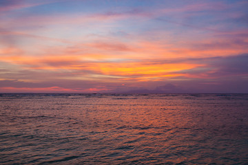 Beautiful sunset over the sea and volcano Agung silhouette on the island of Gili Trawangan, Indonesia